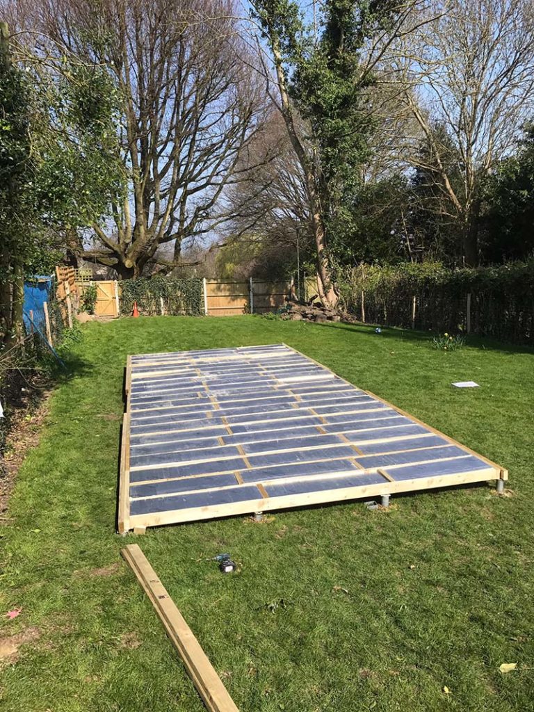 Screw pile foundations for a garden room